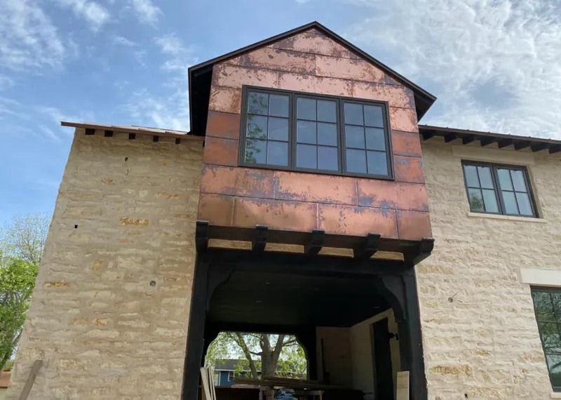 Copper metal panel facade on a stone building for Skylight Installation in Putnam Valley